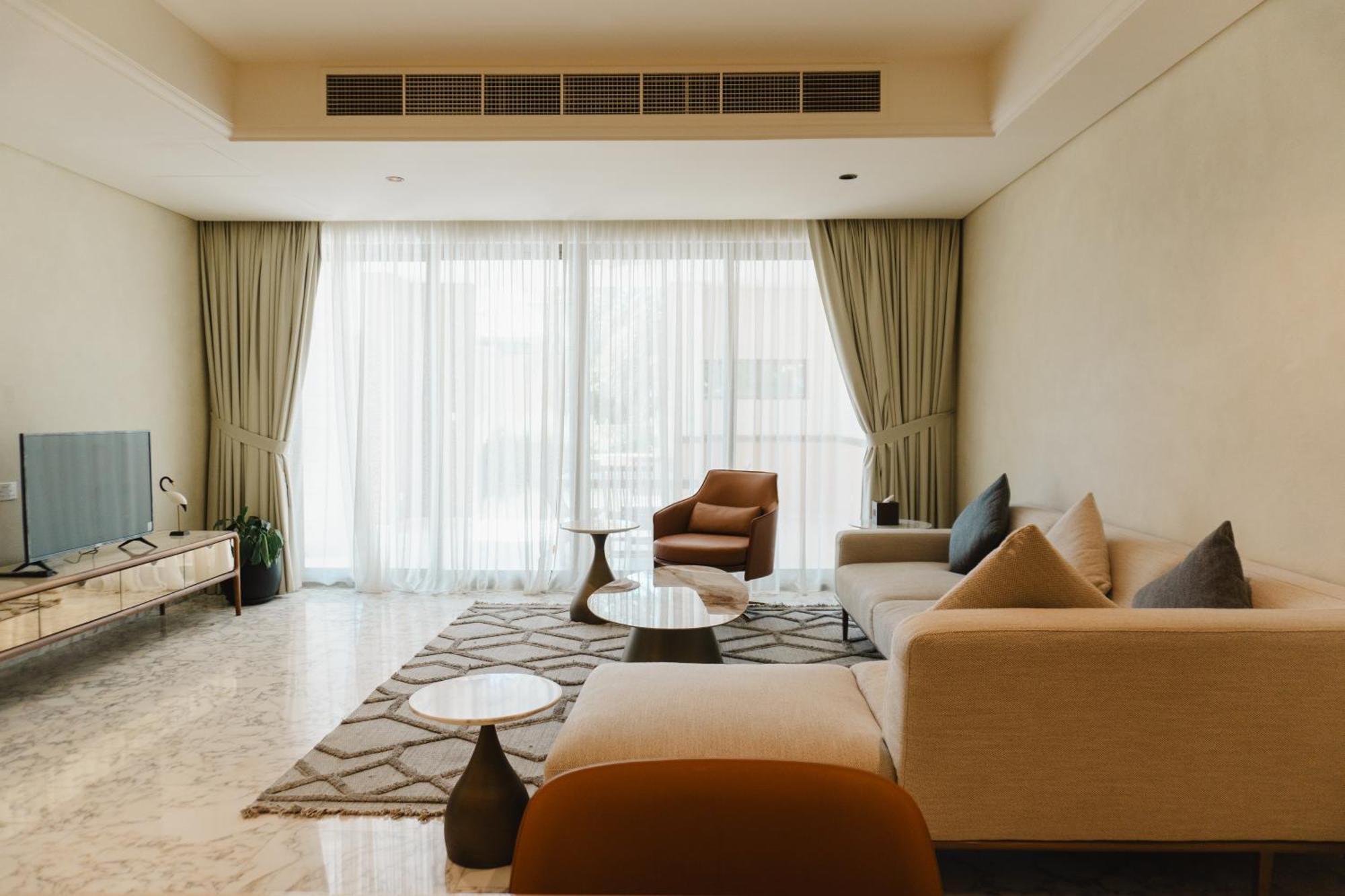 Palavra Resort Manama Exteriör bild A living room in a condominium