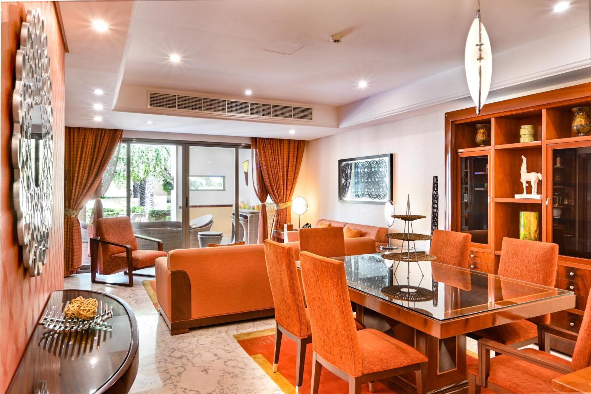 Palavra Resort Manama Exteriör bild A living room in a suite at the hotel